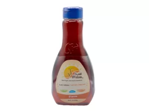 A transparent bottle of sweet melody ketchup with a blue cap, labeled "new natural sweetener cane sweetened ketchup - sweet & delicious, made with care, enjoy more!" against a white background